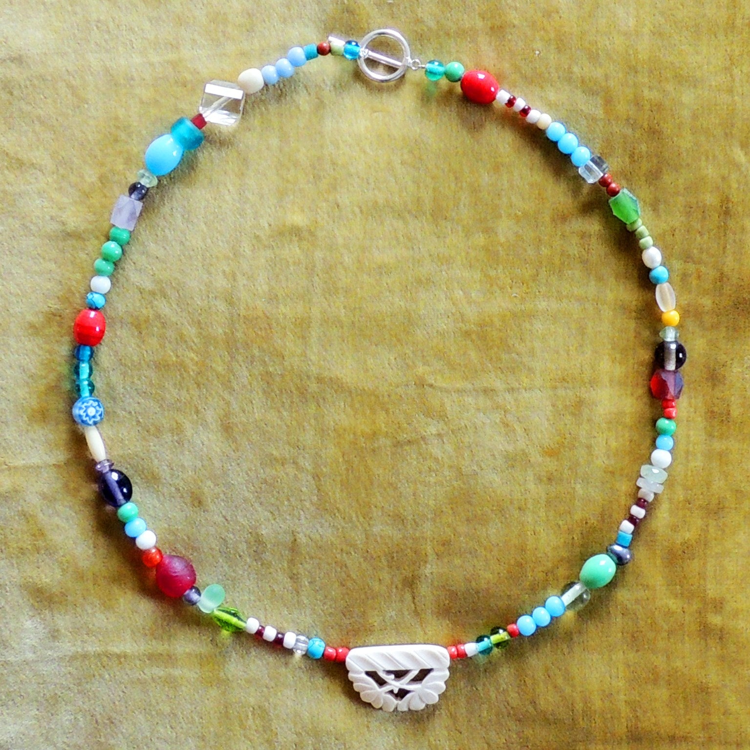 beaded necklace with carved bone bead