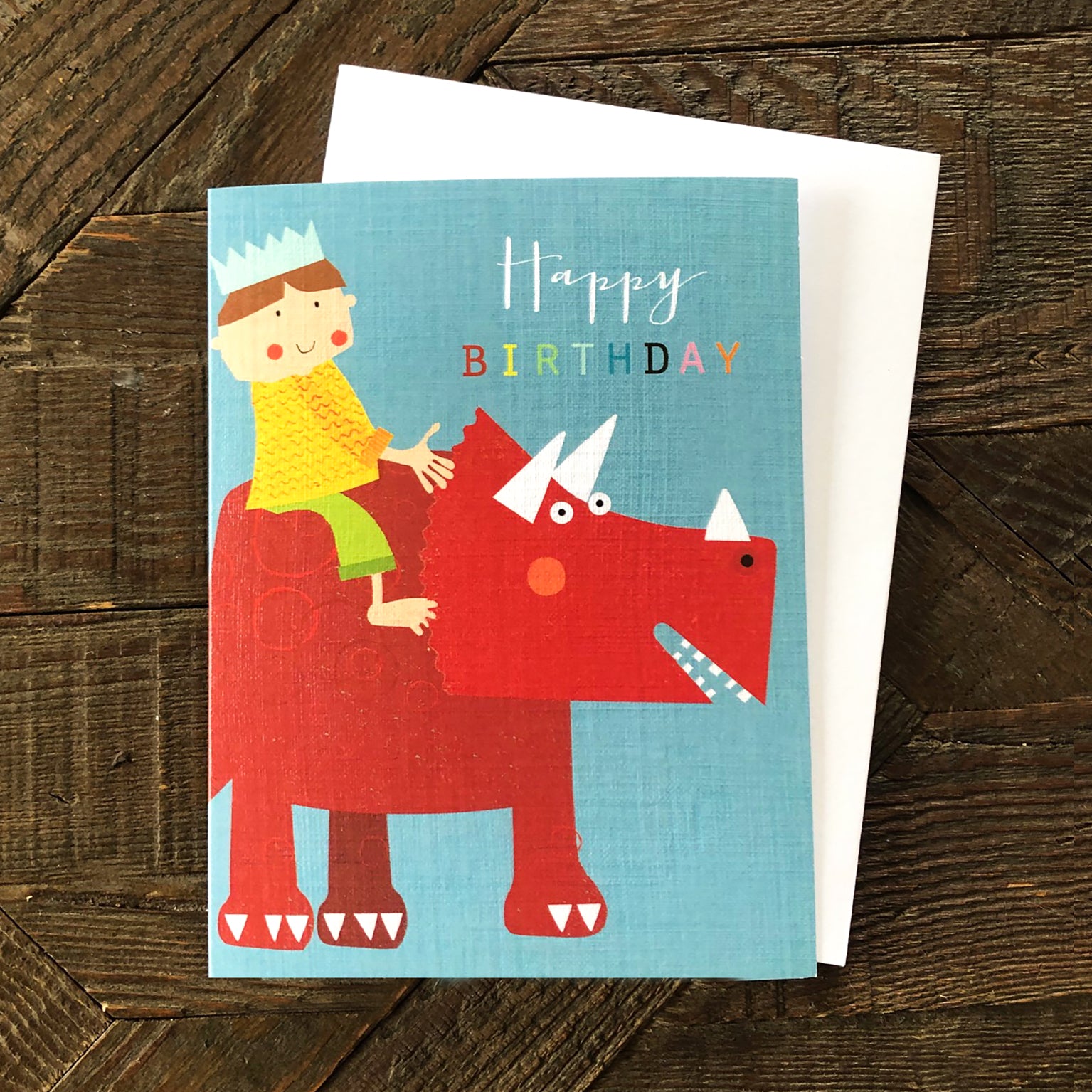 mini boy on a dinosaur birthday card