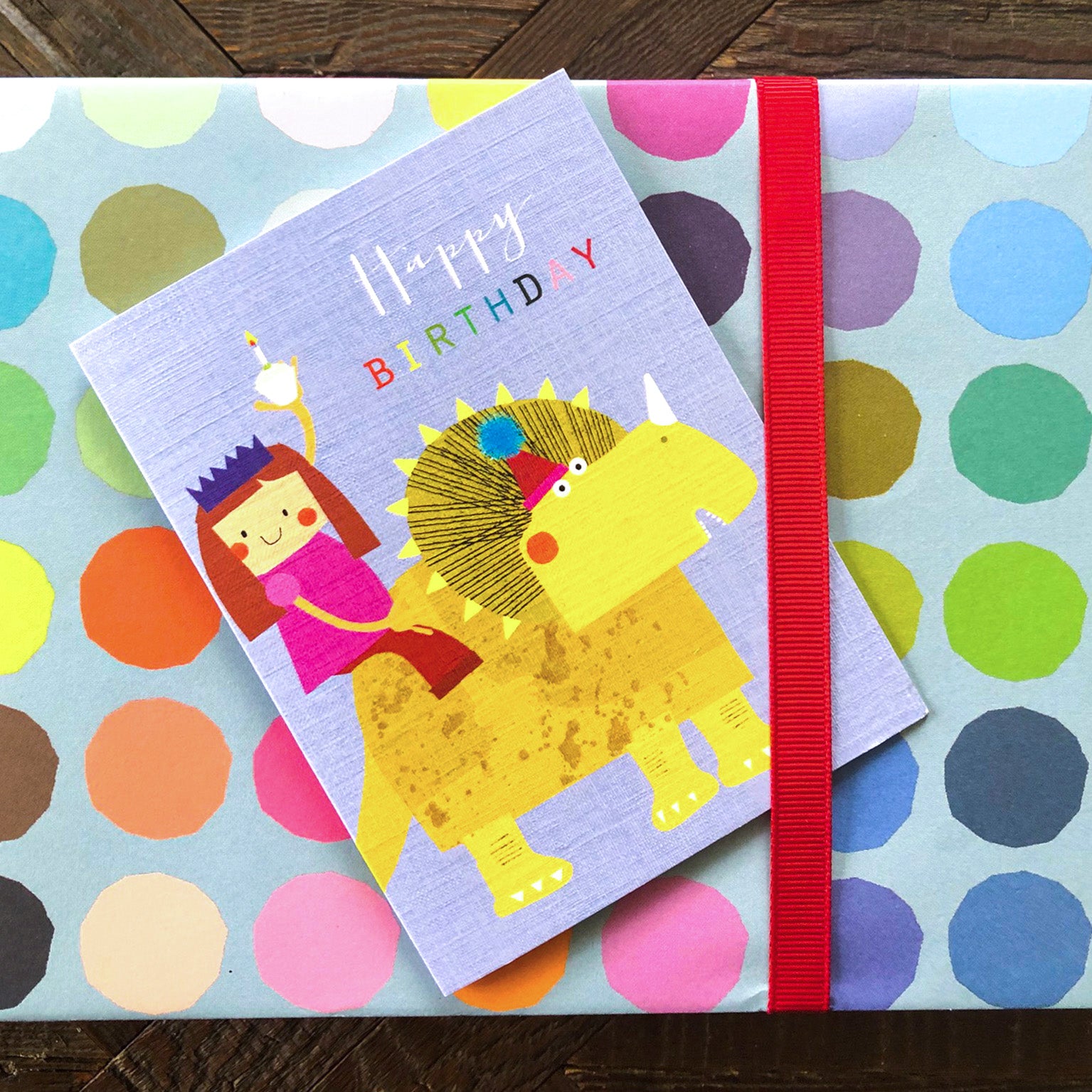 mini girl on a dinosaur birthday card