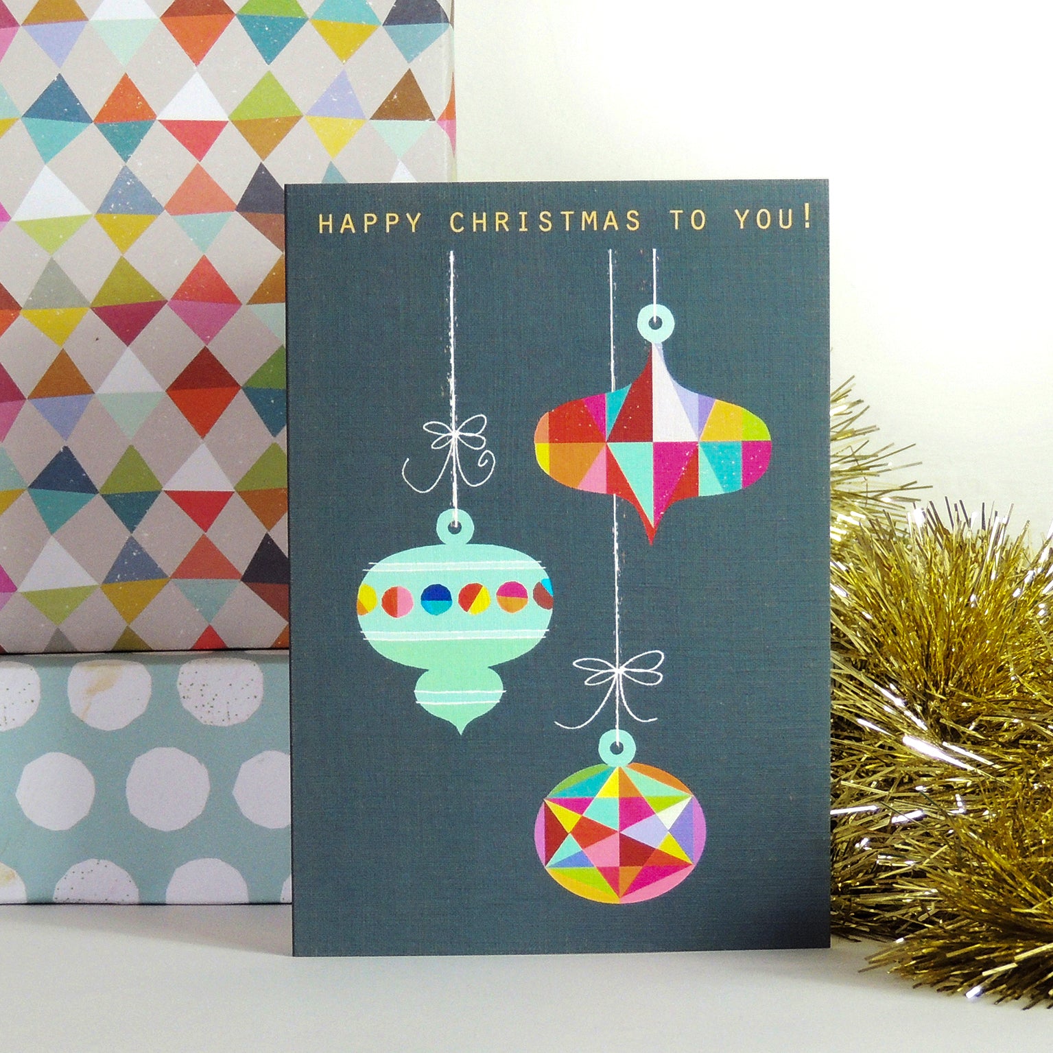 XM05 Christmas baubles greetings card