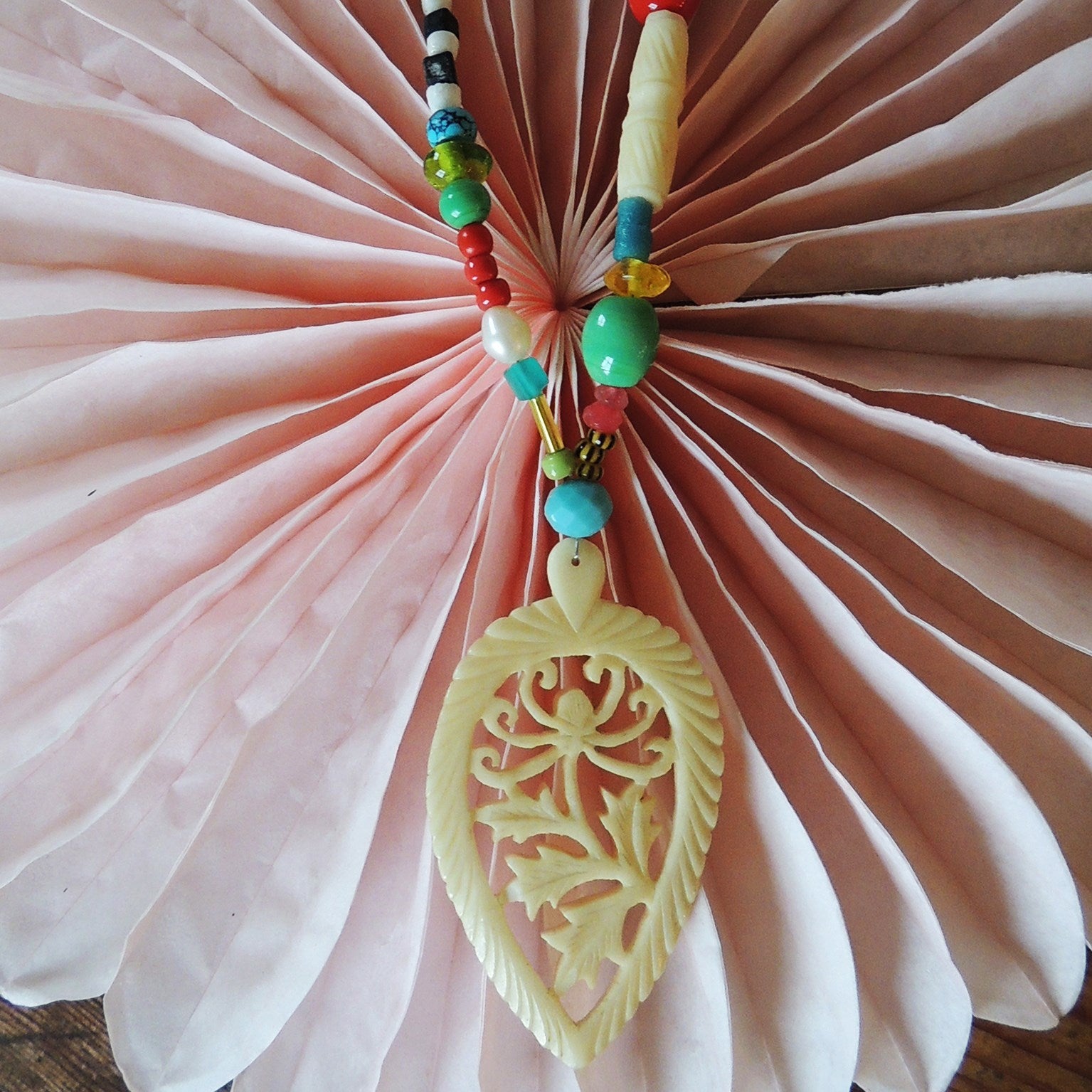 beaded necklace with 1920's carved bone pendant