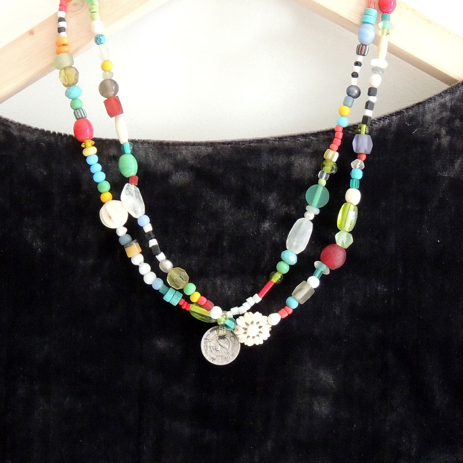 beaded necklace with dainty coin pendant