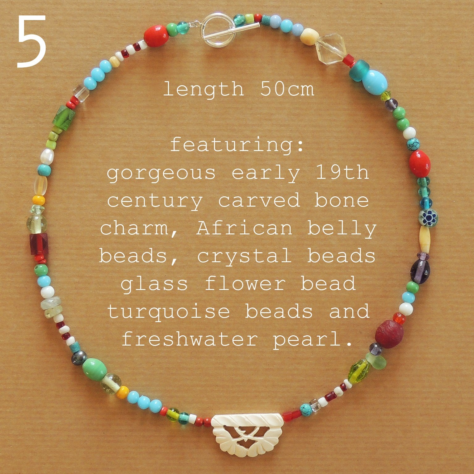 beaded necklace with carved bone bead