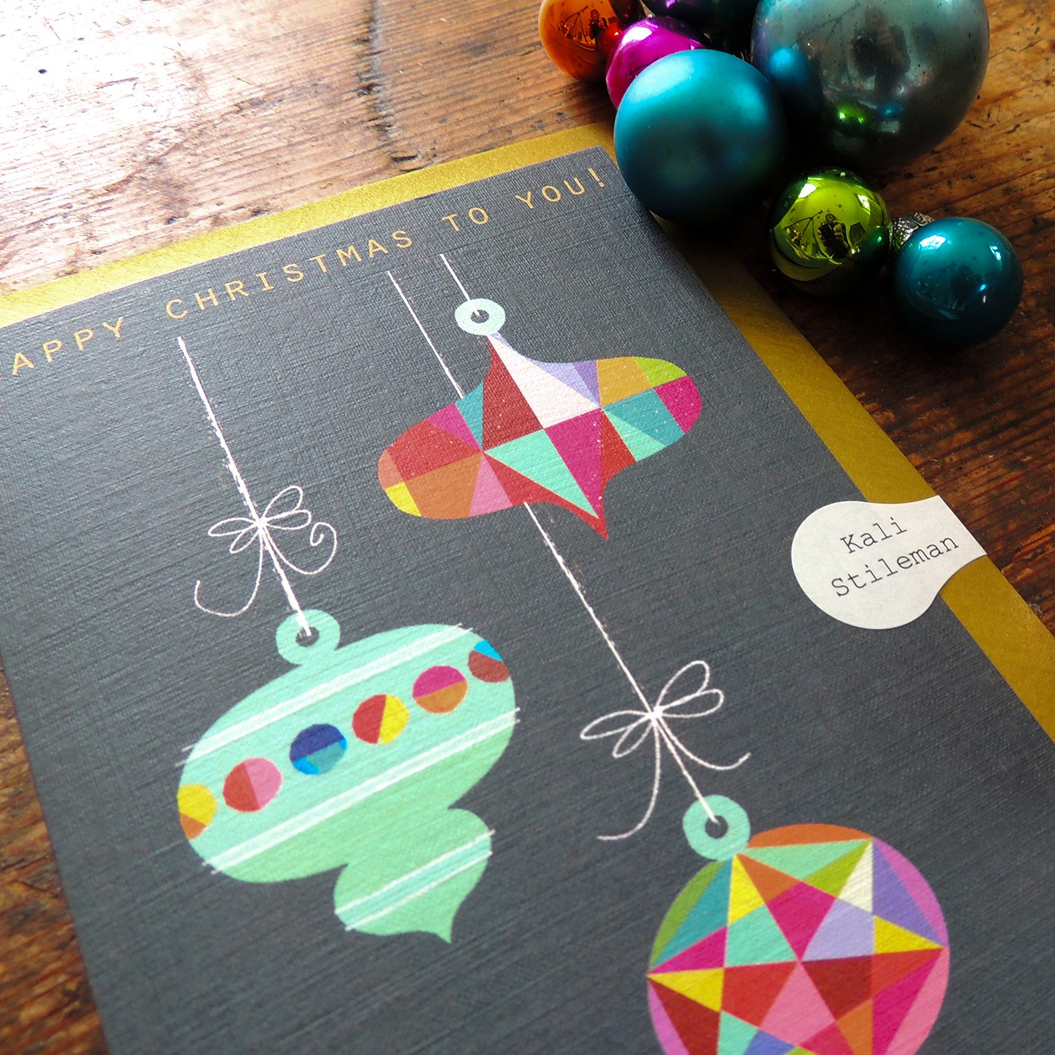 XM05 Christmas baubles greetings card